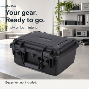 Black ALUBOX FR2 equipment case on a light workbench, showing its carry handle and latches.