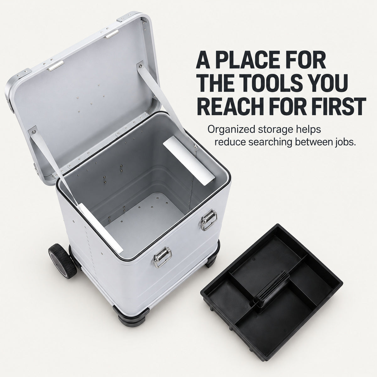 Removable black organizer beside open silver tool case