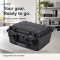 Black ALUBOX FR2 equipment case on a light workbench, showing its carry handle and latches.