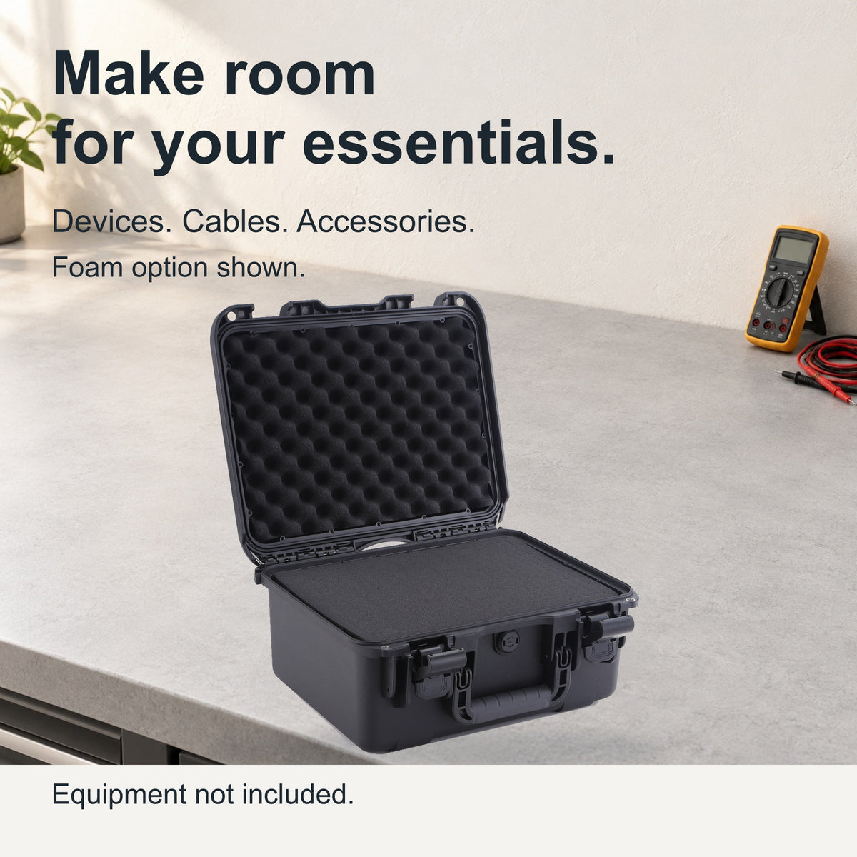 Open black FR2 foam case on a workbench with display equipment outside the case.