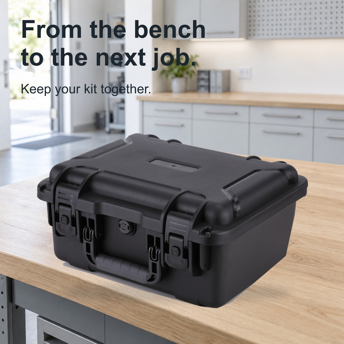 Closed black FR2 hand-carry case by a bright studio exit, with no person shown.